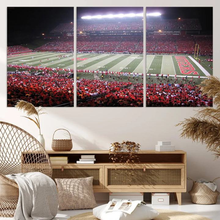 The Rutgers University Scarlet Knights Football Team Print - Piscataway SHI Stadium Wall Art Canvas Print adds an elegant touch to a stylish room. Handmade in the USA, it captures the spirited ambiance of a packed football stadium at night perfectly.