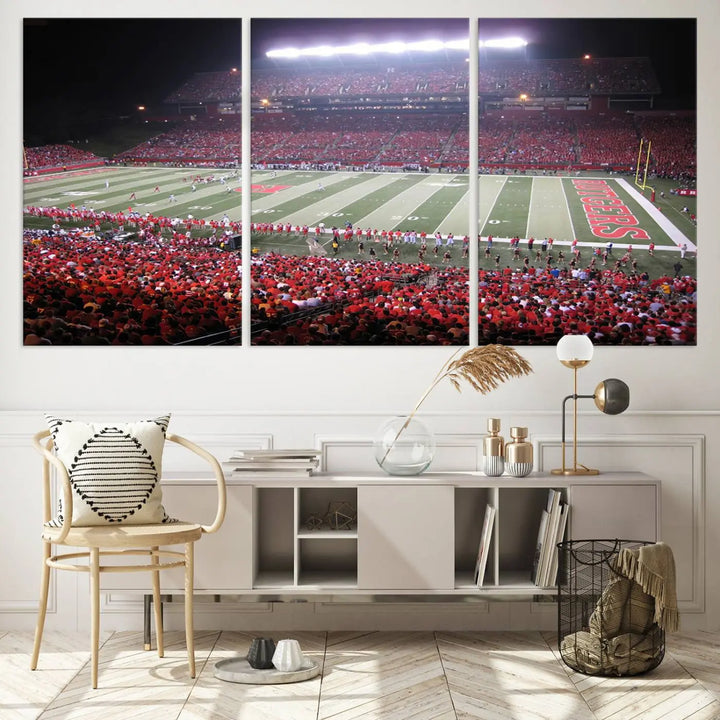 The Rutgers University Scarlet Knights Football Team Print - Piscataway SHI Stadium Wall Art Canvas Print adds an elegant touch to a stylish room. Handmade in the USA, it captures the spirited ambiance of a packed football stadium at night perfectly.