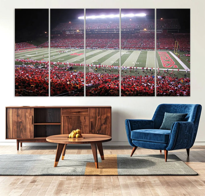 The Rutgers University Scarlet Knights Football Team Print - Piscataway SHI Stadium Wall Art Canvas Print adds an elegant touch to a stylish room. Handmade in the USA, it captures the spirited ambiance of a packed football stadium at night perfectly.