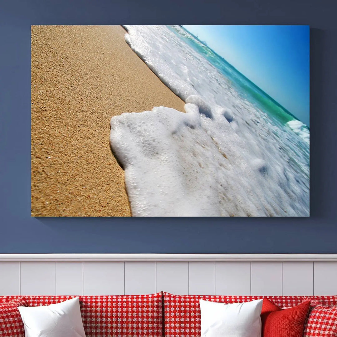 Sandy shoreline close-up ocean wave canvas print. Beach wall art with giclee canvas and gallery wrap, perfect for coastal living decor.