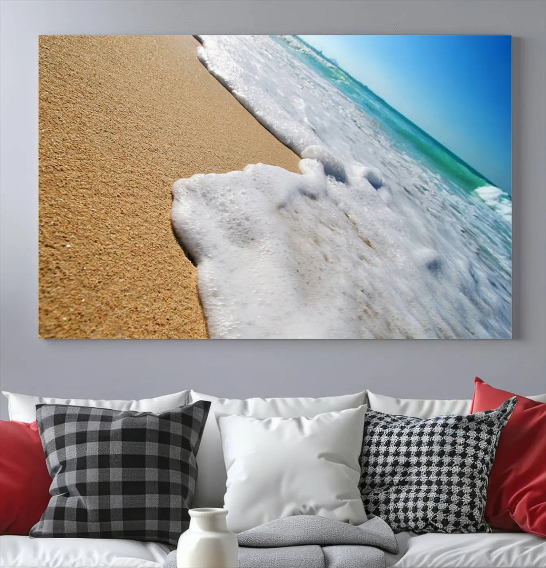 Sandy shoreline close-up ocean wave canvas print. Beach wall art with giclee canvas and gallery wrap, perfect for coastal living decor.