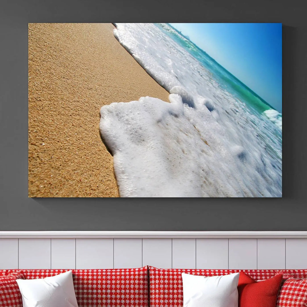 Sandy shoreline close-up ocean wave canvas print. Beach wall art with giclee canvas and gallery wrap, perfect for coastal living decor.