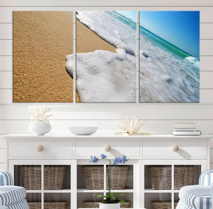 Sandy shoreline close-up ocean wave canvas print. Beach wall art with giclee canvas and gallery wrap, perfect for coastal living decor.