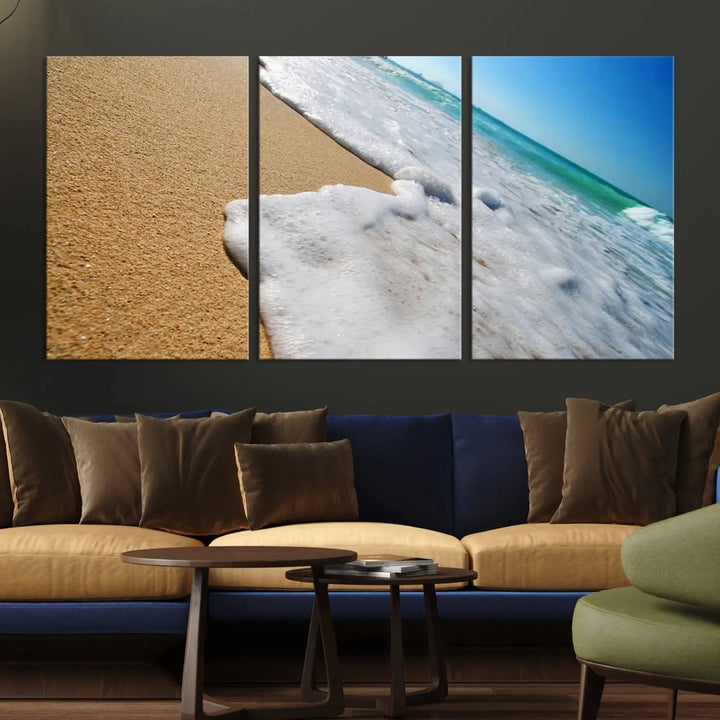 Sandy shoreline close-up ocean wave canvas print. Beach wall art with giclee canvas and gallery wrap, perfect for coastal living decor.