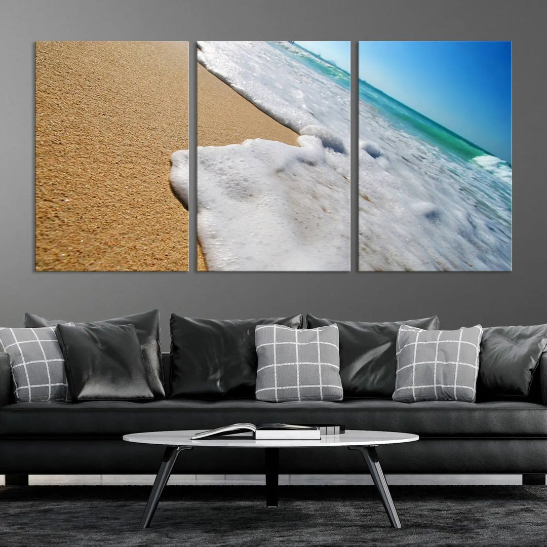 Sandy shoreline close-up ocean wave canvas print. Beach wall art with giclee canvas and gallery wrap, perfect for coastal living decor.