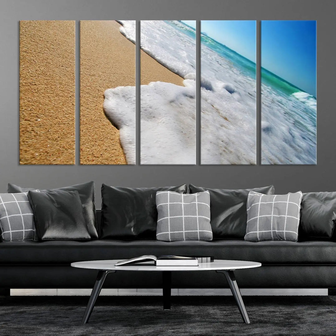 Sandy shoreline close-up ocean wave canvas print. Beach wall art with giclee canvas and gallery wrap, perfect for coastal living decor.