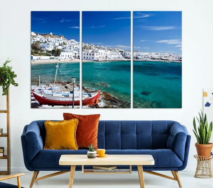 The Santorini Wall Art Canvas Print, showcasing a triptych of a coastal Greek village with white buildings and a turquoise sea, enhances the modern living room.