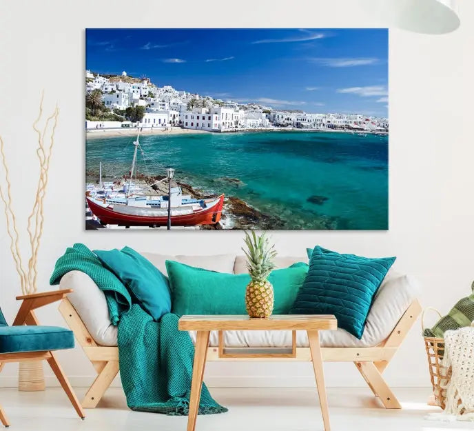 The Santorini Wall Art Canvas Print, showcasing a triptych of a coastal Greek village with white buildings and a turquoise sea, enhances the modern living room.