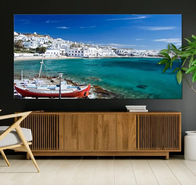 The Santorini Wall Art Canvas Print, showcasing a triptych of a coastal Greek village with white buildings and a turquoise sea, enhances the modern living room.