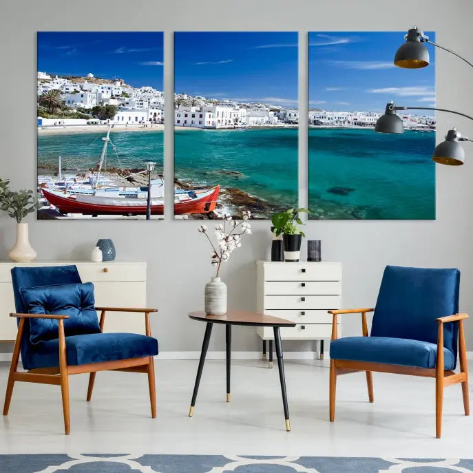 The Santorini Wall Art Canvas Print, showcasing a triptych of a coastal Greek village with white buildings and a turquoise sea, enhances the modern living room.