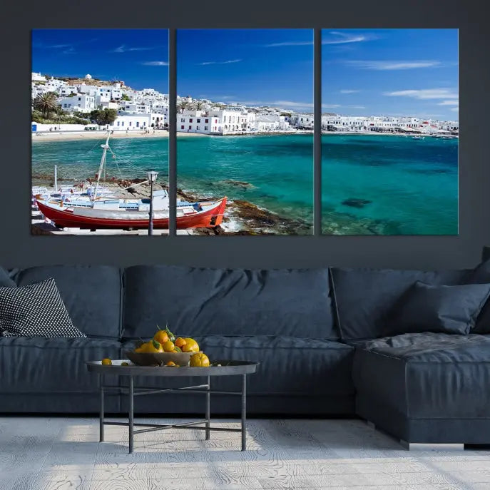 The Santorini Wall Art Canvas Print, showcasing a triptych of a coastal Greek village with white buildings and a turquoise sea, enhances the modern living room.