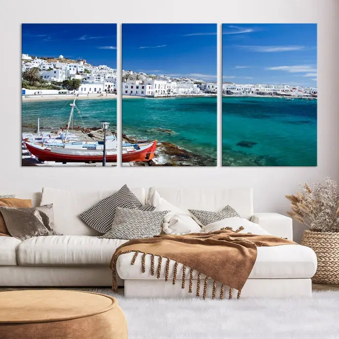 The Santorini Wall Art Canvas Print, showcasing a triptych of a coastal Greek village with white buildings and a turquoise sea, enhances the modern living room.