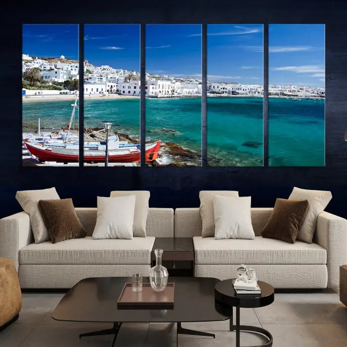 The Santorini Wall Art Canvas Print, showcasing a triptych of a coastal Greek village with white buildings and a turquoise sea, enhances the modern living room.