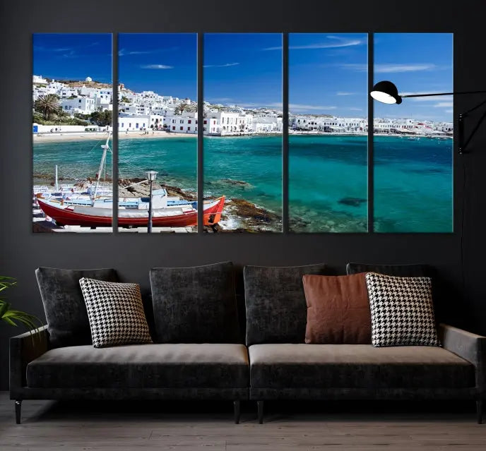 The Santorini Wall Art Canvas Print, showcasing a triptych of a coastal Greek village with white buildings and a turquoise sea, enhances the modern living room.