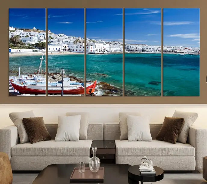 The Santorini Wall Art Canvas Print, showcasing a triptych of a coastal Greek village with white buildings and a turquoise sea, enhances the modern living room.