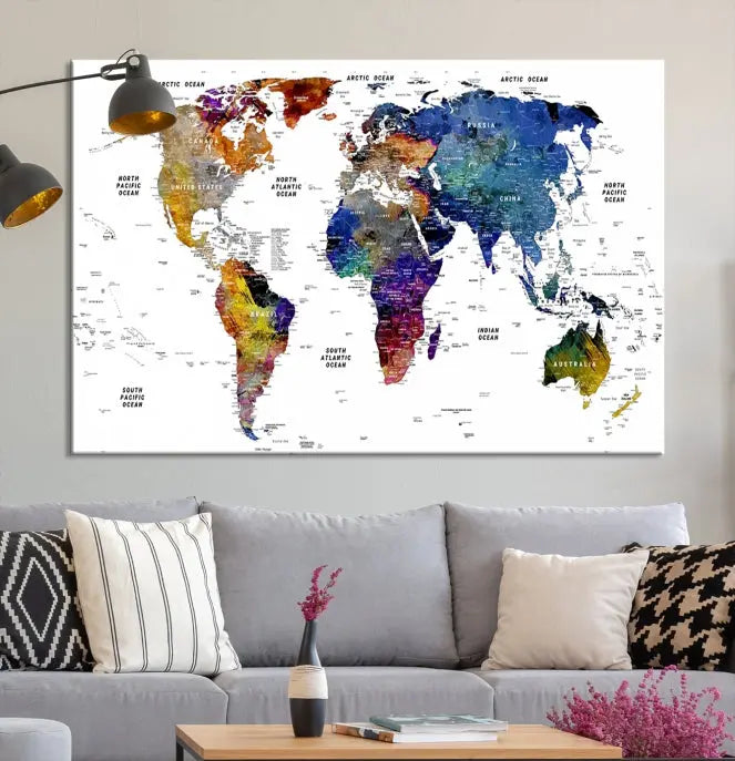 A contemporary living room features the School World Map Canvas Print, a vibrant and multi-panel artwork on museum-quality canvas. This piece is ready to hang, offering both easy installation and enduring appeal.