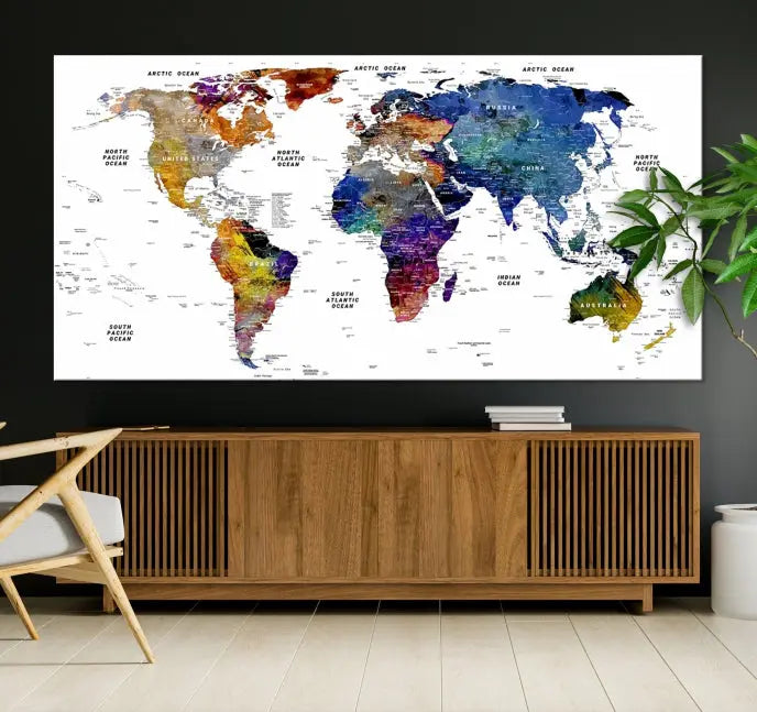 A contemporary living room features the School World Map Canvas Print, a vibrant and multi-panel artwork on museum-quality canvas. This piece is ready to hang, offering both easy installation and enduring appeal.