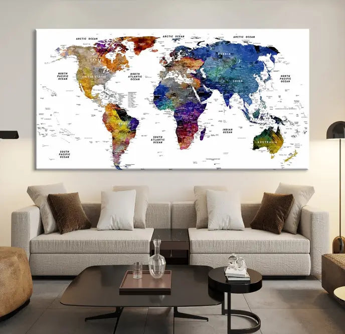 A contemporary living room features the School World Map Canvas Print, a vibrant and multi-panel artwork on museum-quality canvas. This piece is ready to hang, offering both easy installation and enduring appeal.