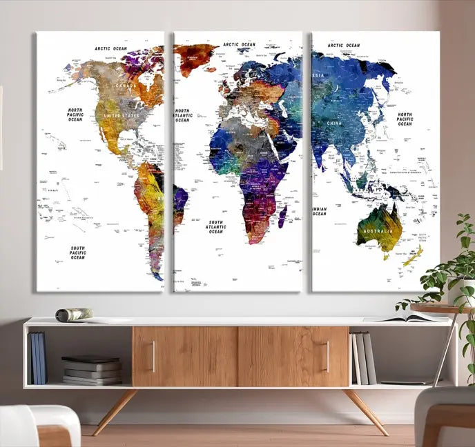 A contemporary living room features the School World Map Canvas Print, a vibrant and multi-panel artwork on museum-quality canvas. This piece is ready to hang, offering both easy installation and enduring appeal.