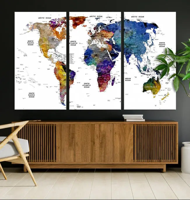 A contemporary living room features the School World Map Canvas Print, a vibrant and multi-panel artwork on museum-quality canvas. This piece is ready to hang, offering both easy installation and enduring appeal.