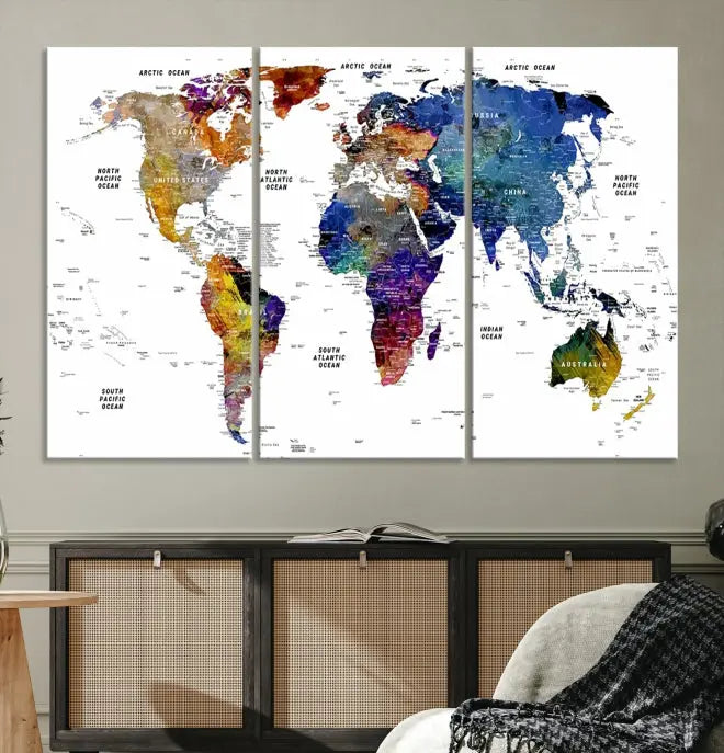 A contemporary living room features the School World Map Canvas Print, a vibrant and multi-panel artwork on museum-quality canvas. This piece is ready to hang, offering both easy installation and enduring appeal.