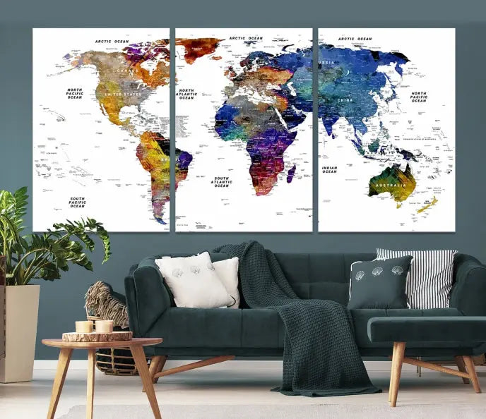 A contemporary living room features the School World Map Canvas Print, a vibrant and multi-panel artwork on museum-quality canvas. This piece is ready to hang, offering both easy installation and enduring appeal.