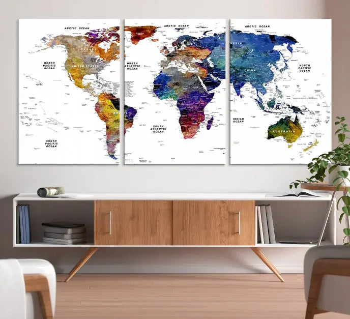 A contemporary living room features the School World Map Canvas Print, a vibrant and multi-panel artwork on museum-quality canvas. This piece is ready to hang, offering both easy installation and enduring appeal.