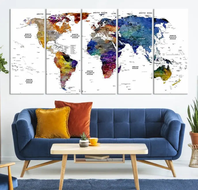 A contemporary living room features the School World Map Canvas Print, a vibrant and multi-panel artwork on museum-quality canvas. This piece is ready to hang, offering both easy installation and enduring appeal.