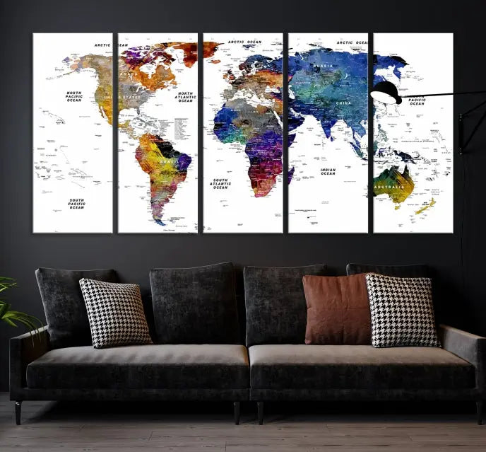 A contemporary living room features the School World Map Canvas Print, a vibrant and multi-panel artwork on museum-quality canvas. This piece is ready to hang, offering both easy installation and enduring appeal.