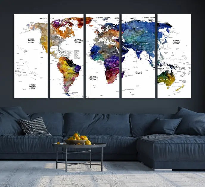 A contemporary living room features the School World Map Canvas Print, a vibrant and multi-panel artwork on museum-quality canvas. This piece is ready to hang, offering both easy installation and enduring appeal.