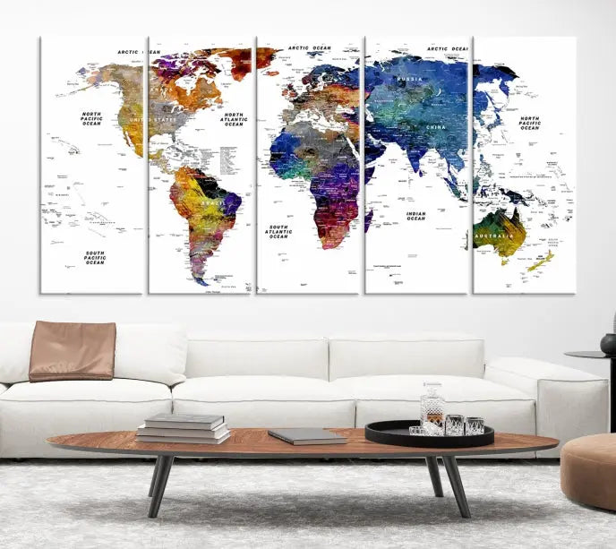 A contemporary living room features the School World Map Canvas Print, a vibrant and multi-panel artwork on museum-quality canvas. This piece is ready to hang, offering both easy installation and enduring appeal.