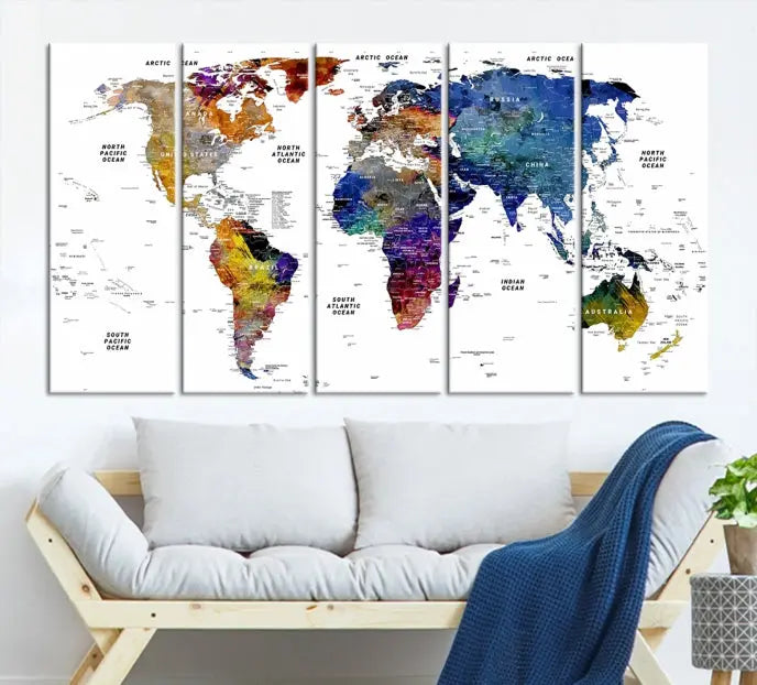 A contemporary living room features the School World Map Canvas Print, a vibrant and multi-panel artwork on museum-quality canvas. This piece is ready to hang, offering both easy installation and enduring appeal.