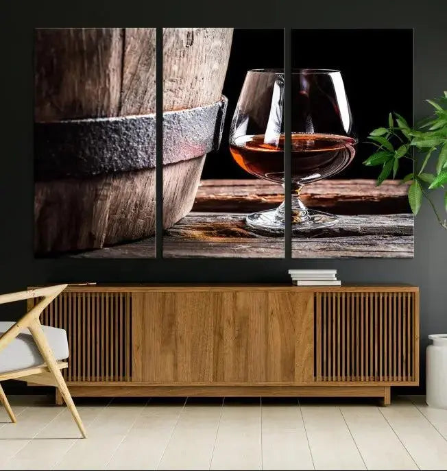 The Scots Whiskey Wall Art Canvas Print, a triptych gallery-wrapped piece crafted with museum-quality precision, showcases a barrel and a glass of whiskey on a wooden table. It includes a UV-protective coating for durability.