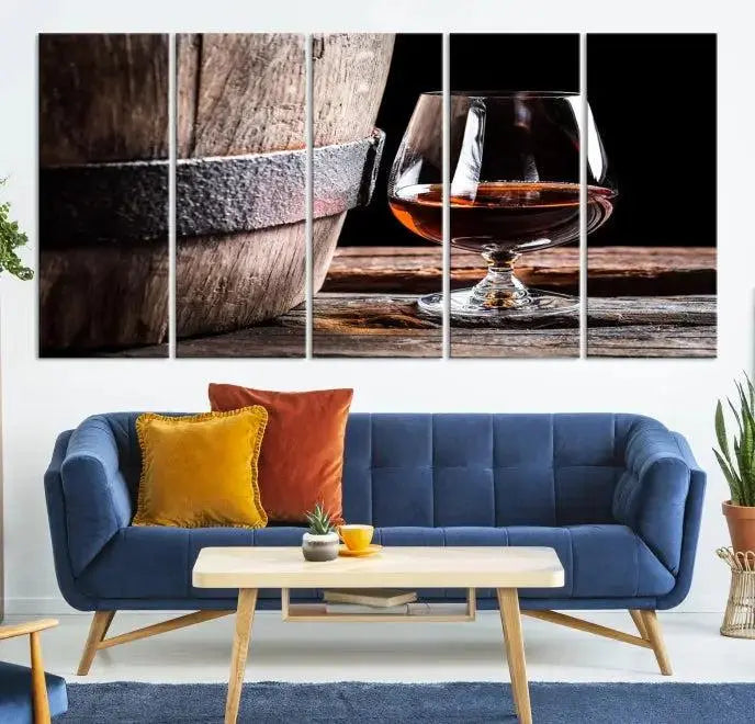 The Scots Whiskey Wall Art Canvas Print, a triptych gallery-wrapped piece crafted with museum-quality precision, showcases a barrel and a glass of whiskey on a wooden table. It includes a UV-protective coating for durability.