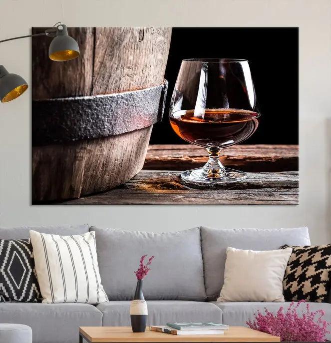 The Scots Whiskey Wall Art Canvas Print, a triptych gallery-wrapped piece crafted with museum-quality precision, showcases a barrel and a glass of whiskey on a wooden table. It includes a UV-protective coating for durability.