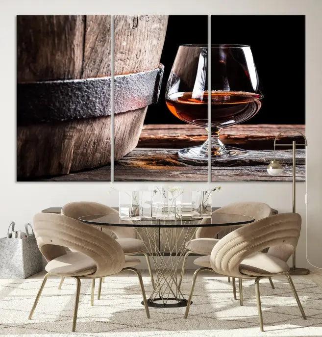 The Scots Whiskey Wall Art Canvas Print, a triptych gallery-wrapped piece crafted with museum-quality precision, showcases a barrel and a glass of whiskey on a wooden table. It includes a UV-protective coating for durability.