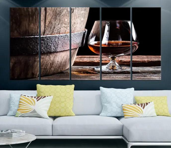 The Scots Whiskey Wall Art Canvas Print, a triptych gallery-wrapped piece crafted with museum-quality precision, showcases a barrel and a glass of whiskey on a wooden table. It includes a UV-protective coating for durability.