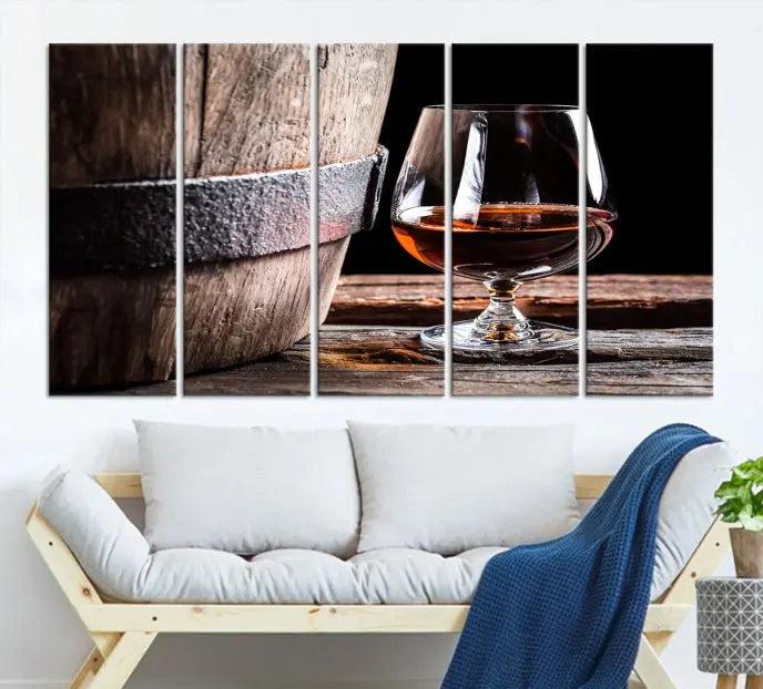 The Scots Whiskey Wall Art Canvas Print, a triptych gallery-wrapped piece crafted with museum-quality precision, showcases a barrel and a glass of whiskey on a wooden table. It includes a UV-protective coating for durability.