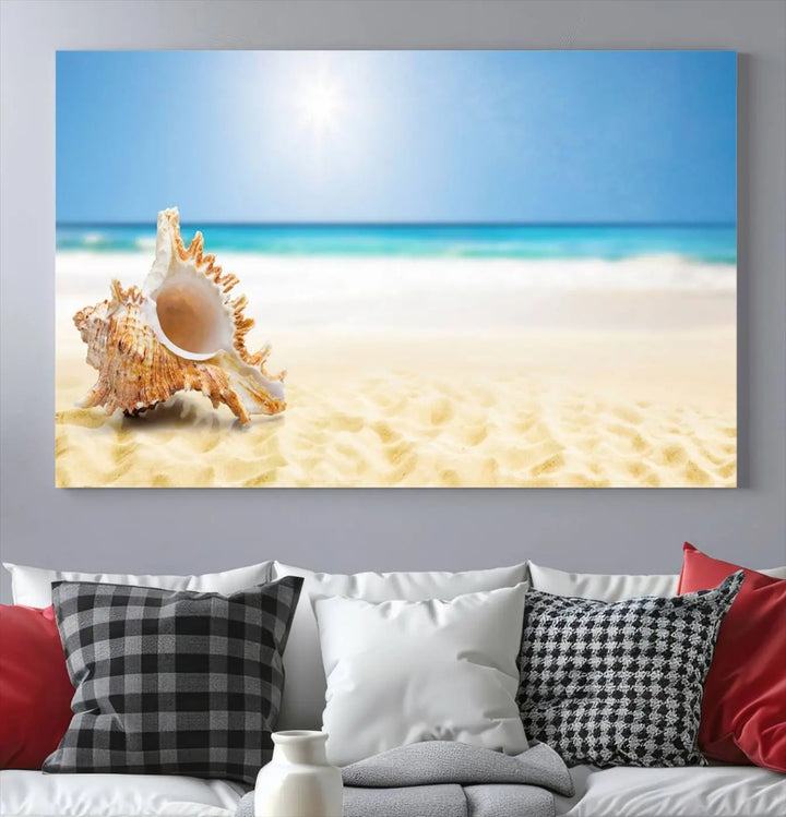 The Sea Shell on The Beach Sun Sand Wall Art Canvas Print is a triptych that beautifully captures a beach scene with a large seashell on the sand.