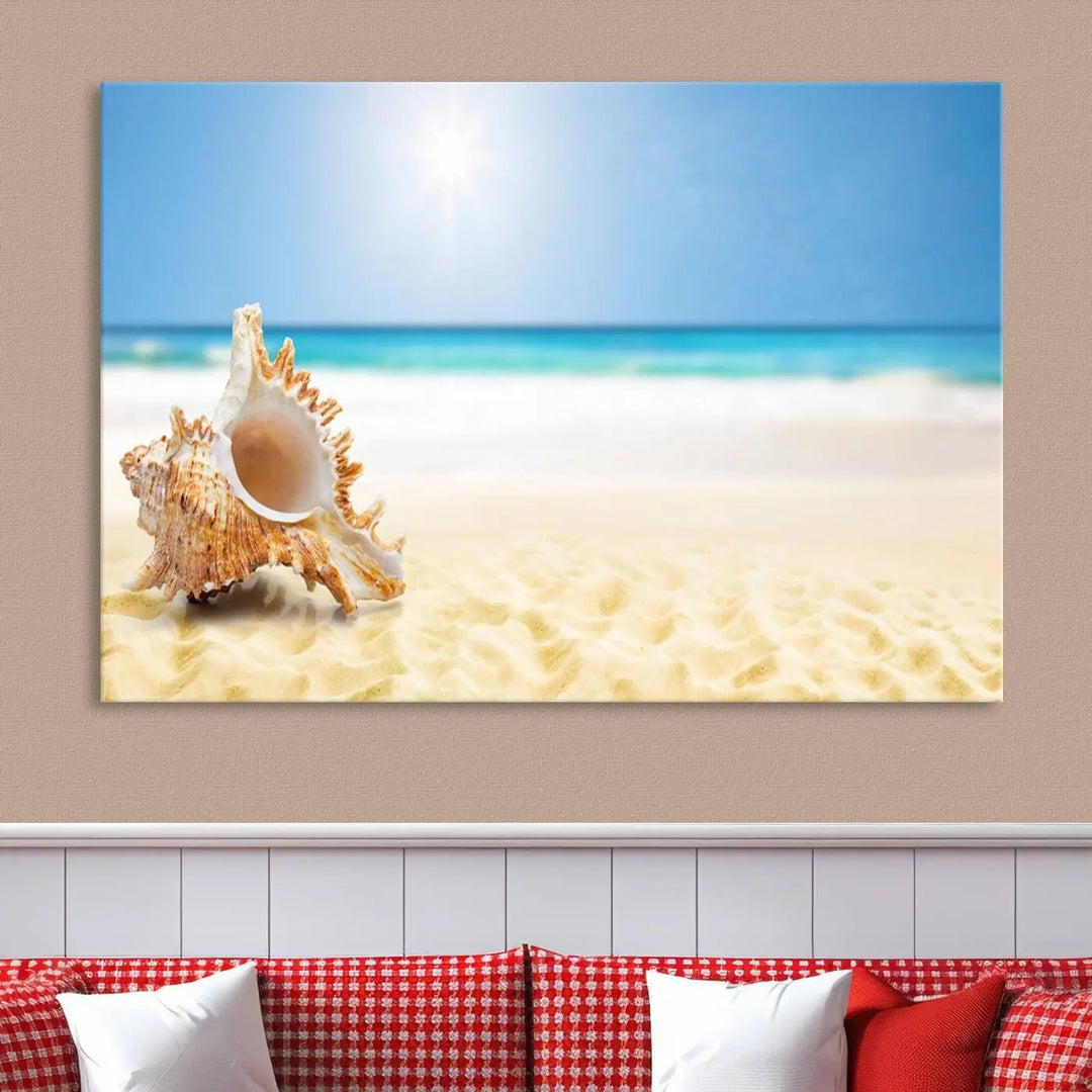 The Sea Shell on The Beach Sun Sand Wall Art Canvas Print is a triptych that beautifully captures a beach scene with a large seashell on the sand.