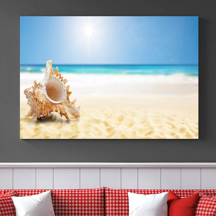 The Sea Shell on The Beach Sun Sand Wall Art Canvas Print is a triptych that beautifully captures a beach scene with a large seashell on the sand.