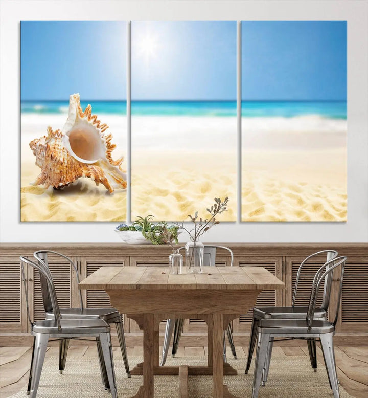 The Sea Shell on The Beach Sun Sand Wall Art Canvas Print is a triptych that beautifully captures a beach scene with a large seashell on the sand.