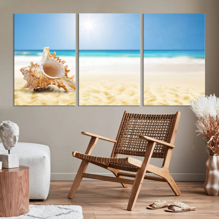 The Sea Shell on The Beach Sun Sand Wall Art Canvas Print is a triptych that beautifully captures a beach scene with a large seashell on the sand.