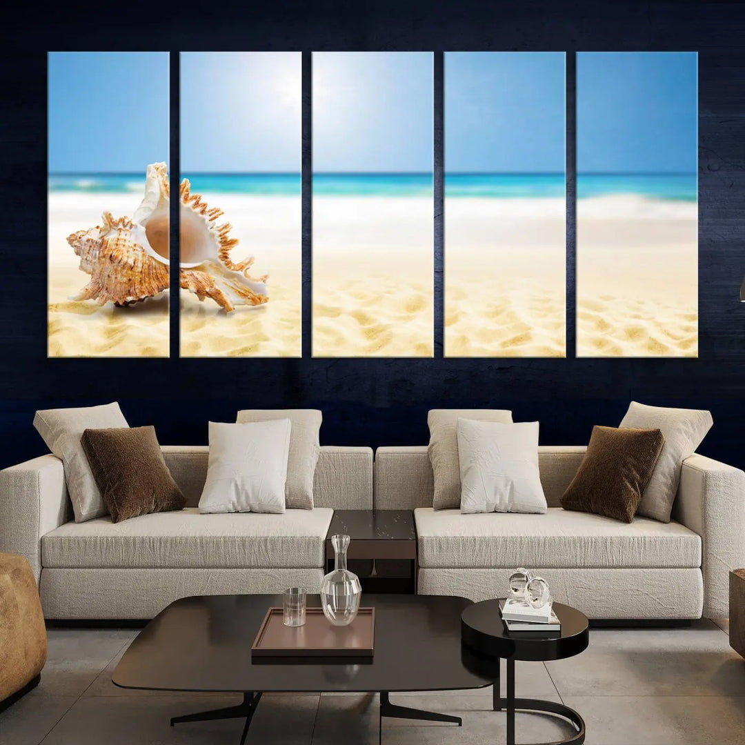 The Sea Shell on The Beach Sun Sand Wall Art Canvas Print is a triptych that beautifully captures a beach scene with a large seashell on the sand.