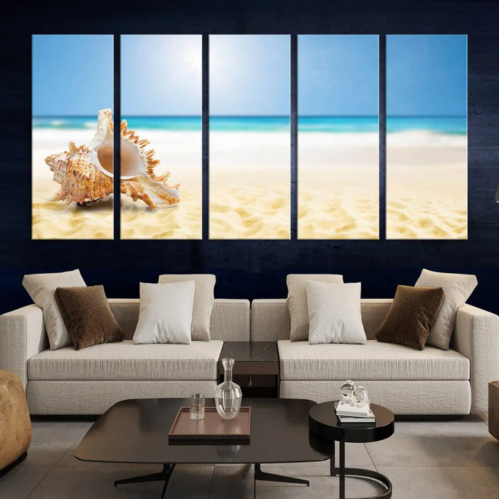 The Sea Shell on The Beach Sun Sand Wall Art Canvas Print is a triptych that beautifully captures a beach scene with a large seashell on the sand.