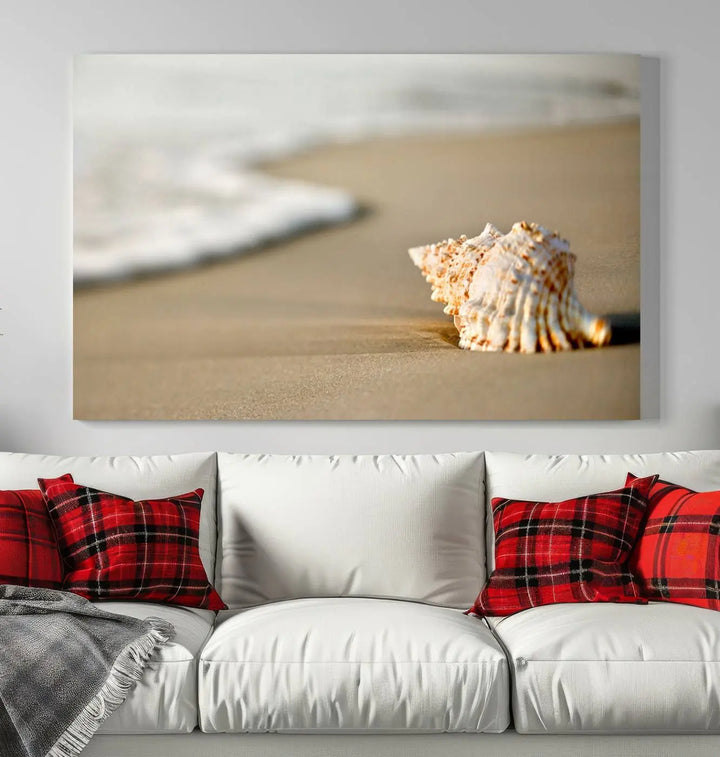 The triptych artwork titled "Sea Shell on the Beach Canvas Wall Art Beach Canvas Print" showcases a seashell on a sandy beach with ocean waves in the background, creating a stunning piece of coastal wall decor.