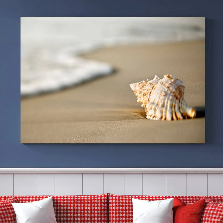 The triptych artwork titled "Sea Shell on the Beach Canvas Wall Art Beach Canvas Print" showcases a seashell on a sandy beach with ocean waves in the background, creating a stunning piece of coastal wall decor.