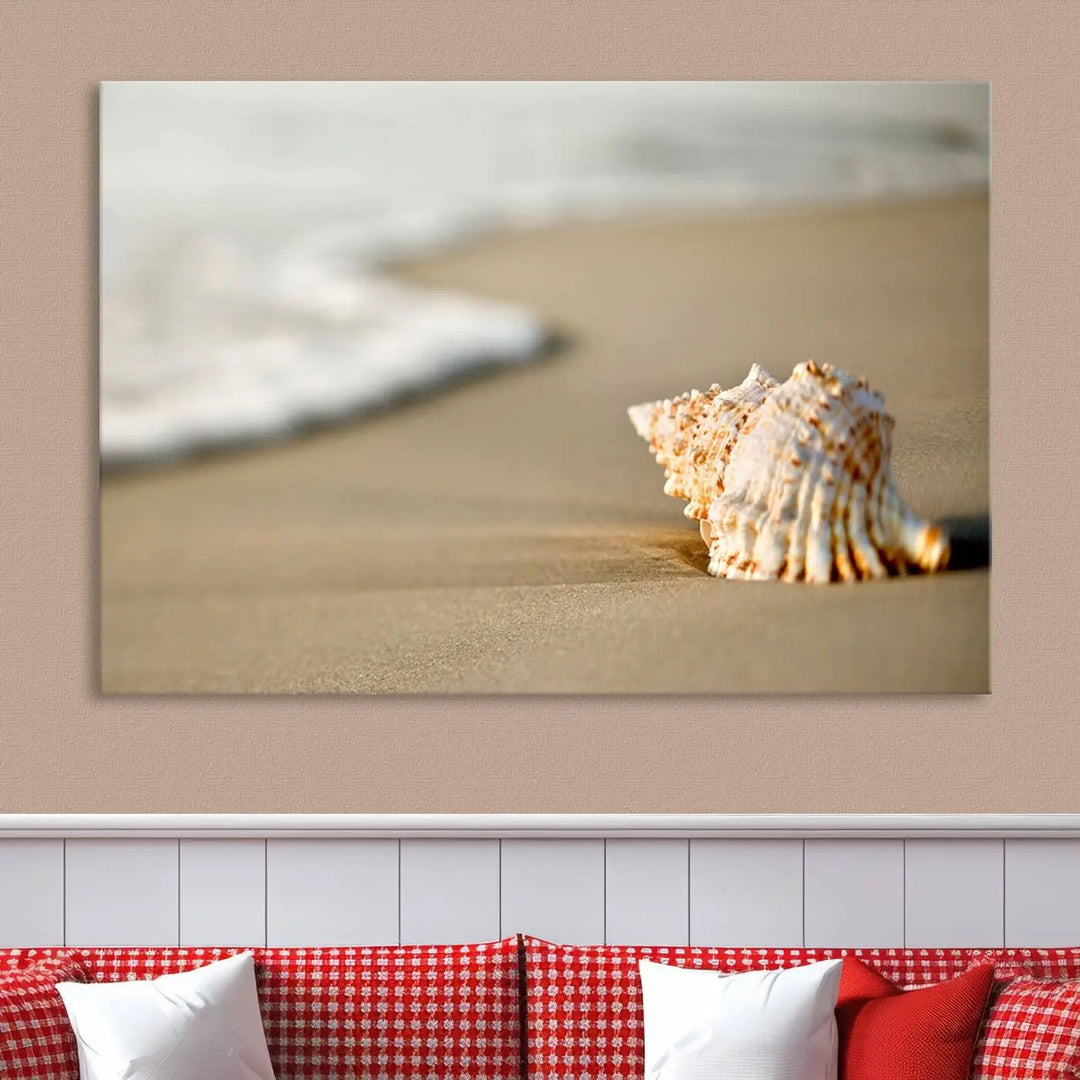 The triptych artwork titled "Sea Shell on the Beach Canvas Wall Art Beach Canvas Print" showcases a seashell on a sandy beach with ocean waves in the background, creating a stunning piece of coastal wall decor.