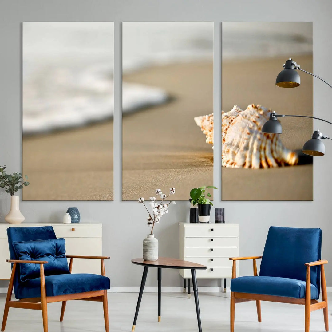 The triptych artwork titled "Sea Shell on the Beach Canvas Wall Art Beach Canvas Print" showcases a seashell on a sandy beach with ocean waves in the background, creating a stunning piece of coastal wall decor.