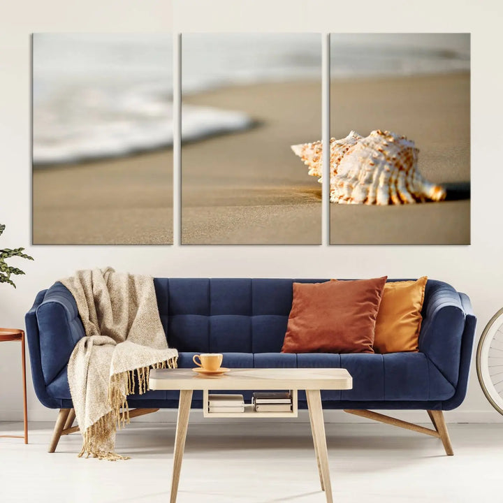 The triptych artwork titled "Sea Shell on the Beach Canvas Wall Art Beach Canvas Print" showcases a seashell on a sandy beach with ocean waves in the background, creating a stunning piece of coastal wall decor.